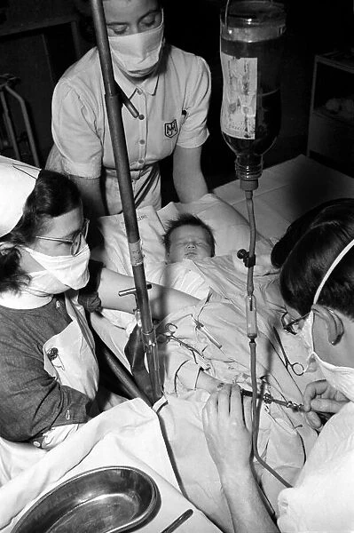 Hospital operation hearts. Babys life saved by blood transfusion. October 1946 O5112-001