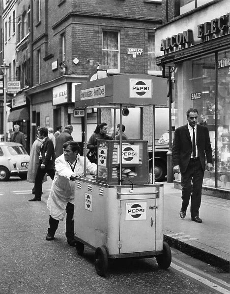 Hot Dogs, John O Brien of Londons West End, pushes his hot dog stand