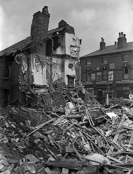 A house in Aston, Birmingham, collapsed after the building received a direct hit during