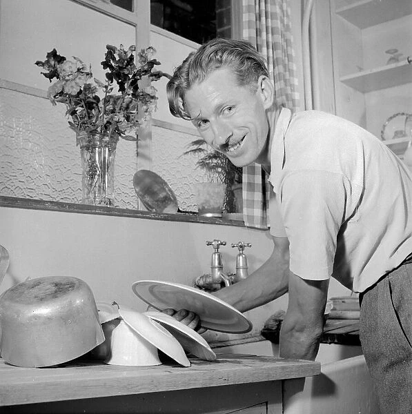 House husband helps with the washing up Circa 1957