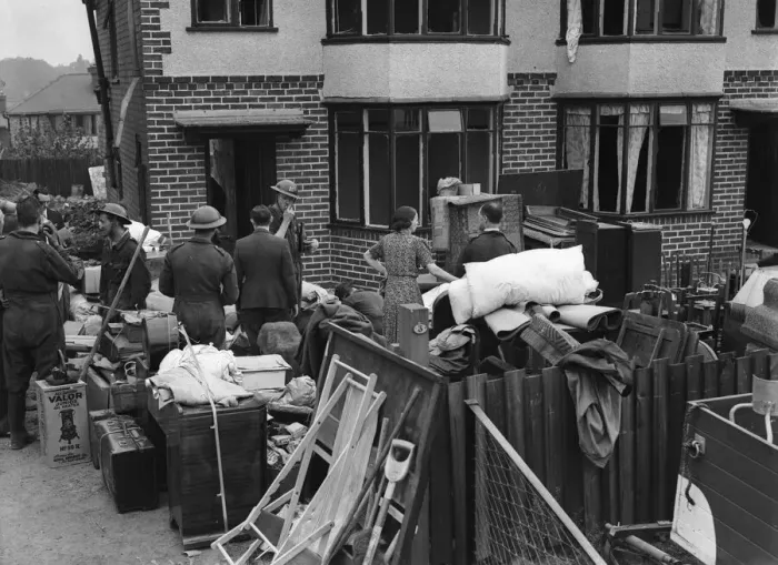 Framed Print : Householders and ARP recovery squad removing furniture from their bomb damage home in Framed Print : Householders and ARP recovery squad removing furniture from their bomb damage home in