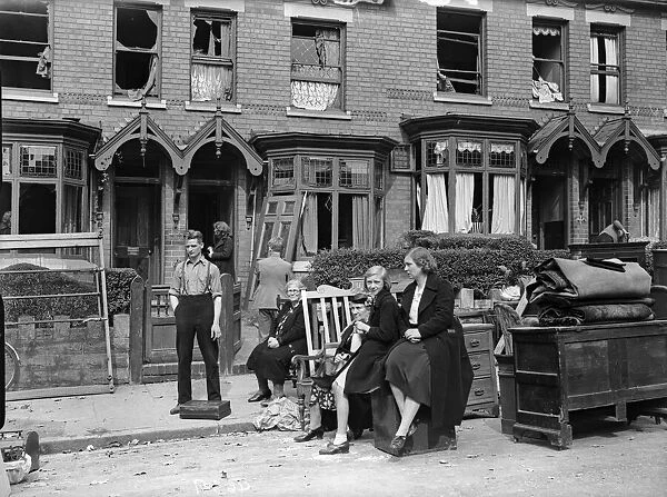 Householders removing furniture from their bomb damage home in Smallheath