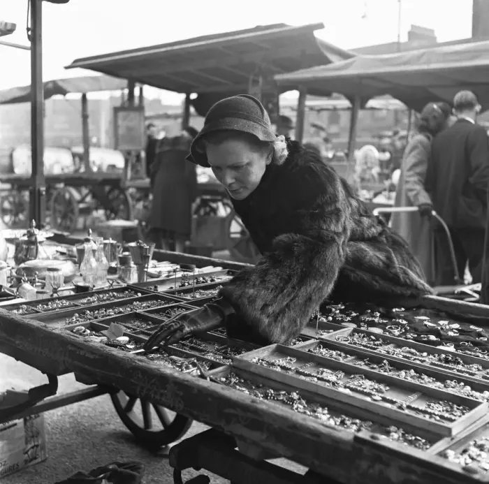 Framed Print : Housewife browsing the antique stalls of the New Caledonian Street Market for jewellery