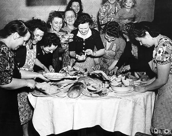 Housewives in East Ham London prepare sandwiches for a farewell party for soldiers