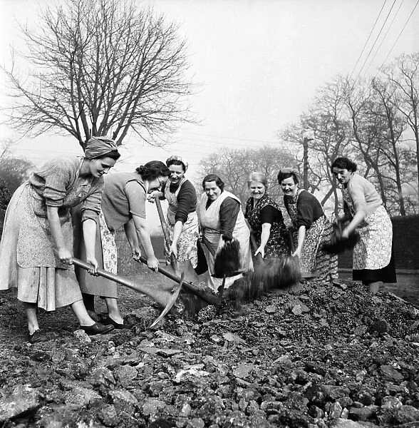 Housewives of Forge Row Aberavan seen here building their own road. March 1953 D1204-001