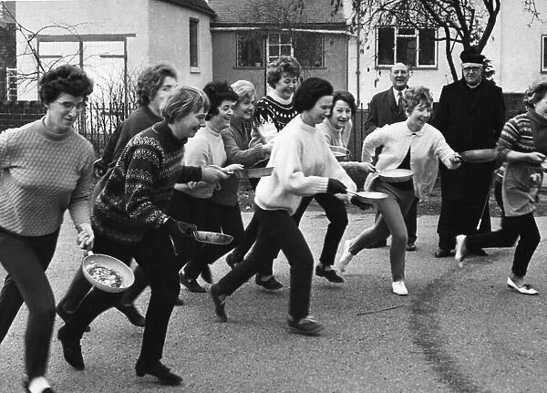 Housewives at whittington, near Lichfield, were out practising for tehir Shrove Tuesday
