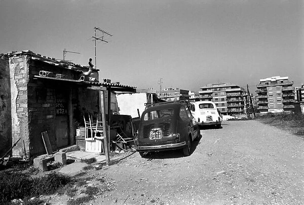 Housing and motor cars in a poor suburb on the outskirts of Rome, Italy April 1975