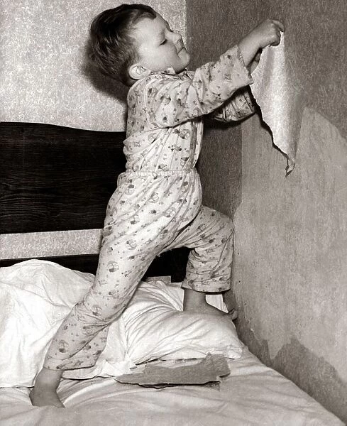 Howard strips bedroom wallpaper. September 1953 13  /  09  /  1953
