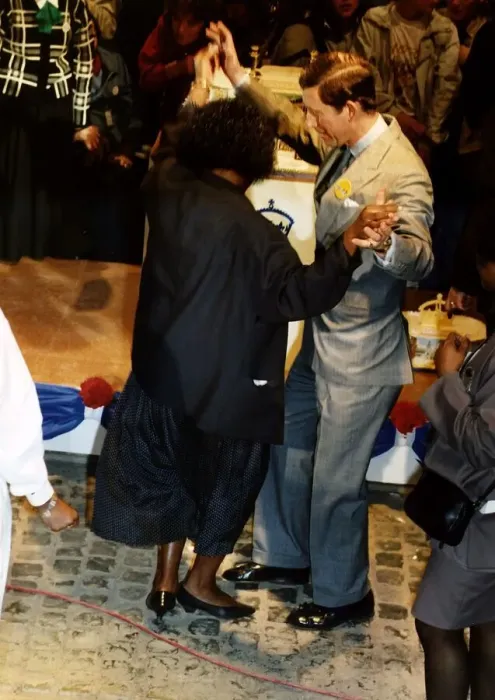 Framed Print : HRH Prince Charles dances with a member of the crowd during 40th birthday celebrations Framed Print : HRH Prince Charles dances with a member of the crowd during 40th birthday celebrations