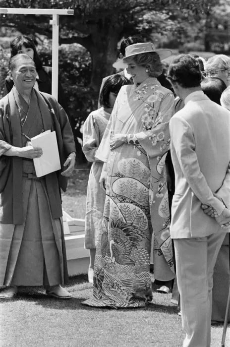 Framed Print : HRH Princess Diana, The Princess of Wales, is helped by city officials to wear a
