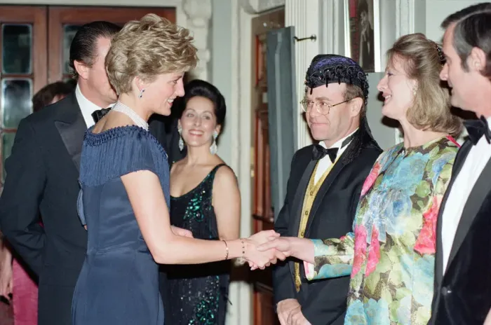 Framed Print : HRH Princess Diana, Princess of Wales is greeted by guests including singer Elton John Framed Print : HRH Princess Diana, Princess of Wales is greeted by guests including singer Elton John