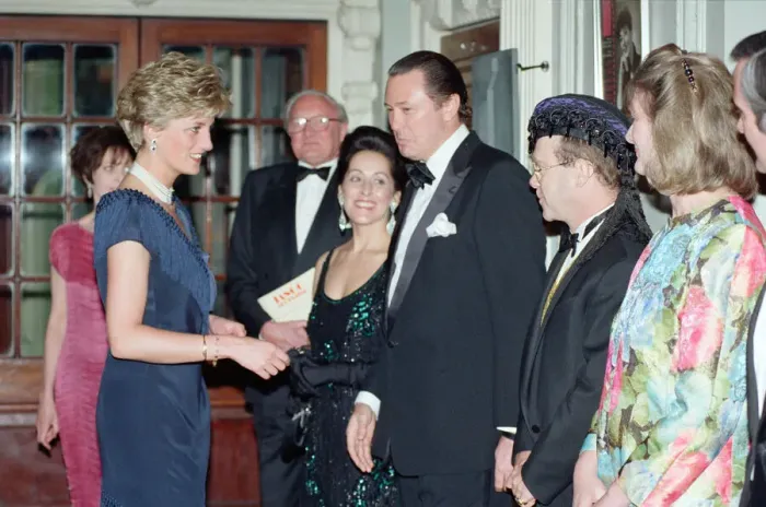 Framed Print : HRH Princess Diana, Princess of Wales is greeted by singer Elton John Framed Print : HRH Princess Diana, Princess of Wales is greeted by singer Elton John