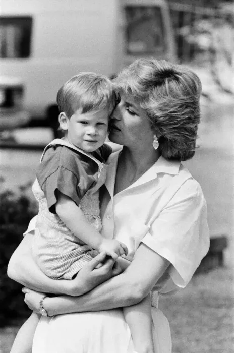 Framed Print : HRH Princess Diana, The Princess of Wales holds her young son Prince Harry on holiday in
