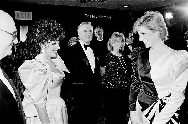 HRH Princess Diana, The Princess of Wales (right) meets actor Joan Collins at the Film