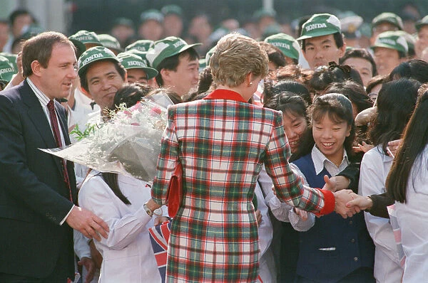 HRH Princess Diana, The Princess of Wales with workers at the Honda factory in Tokyo