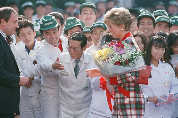 HRH Princess Diana, The Princess of Wales with workers at the Honda factory in Tokyo