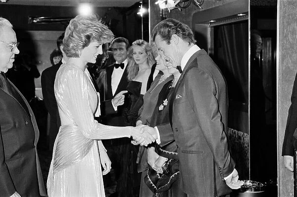 HRH The Princess of Wales, Princess Diana greets lead actor Roger Moore at The Royal