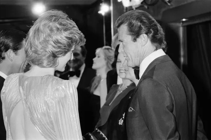 Framed Print : HRH The Princess of Wales, Princess Diana talking with lead actor Roger Moore Framed Print : HRH The Princess of Wales, Princess Diana talking with lead actor Roger Moore
