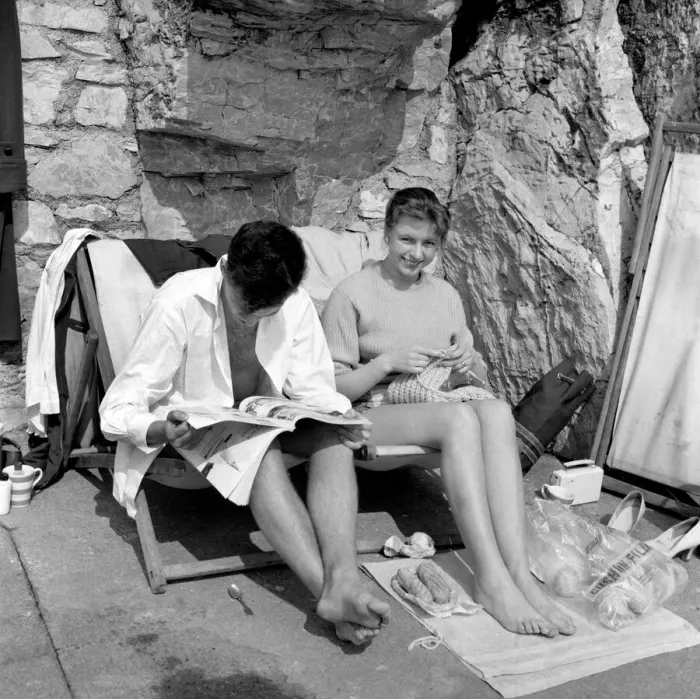 Framed Print : Hubby sitting in his unbuttoned shirt, bare legs and feet, dozes over a magazine