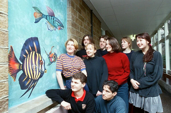 Huddersfield New College pupils are pictured by the mural they spent six months painting