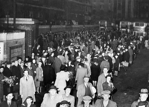 Huge bus queues outside Victoria Station. April 1945 P012041