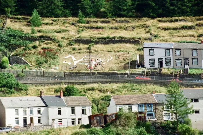 Framed Print : A huge Dragon made from recycled marble on the hillside in Blaenllechau Framed Print : A huge Dragon made from recycled marble on the hillside in Blaenllechau