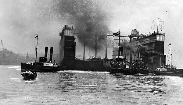 The huge floating dock built at Wallsend passes down the River Tyne on its long journey