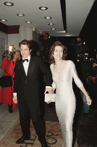 Hugh Grant and his girlfriend, model and actor Elizabeth Hurley arrive for The London