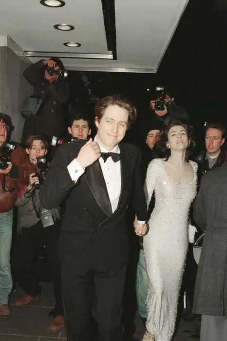 Framed Print : Hugh Grant and his girlfriend, model and actor Elizabeth Hurley arrive for The London