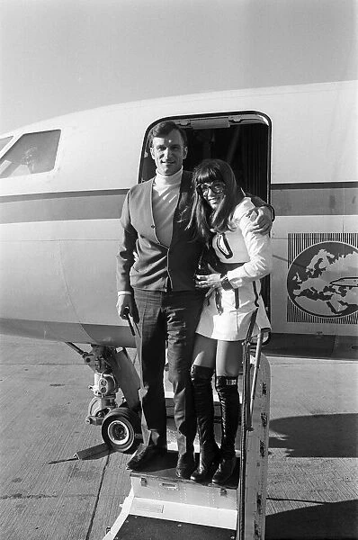Hugh Hefner arriving at Gatwick Airport with his girlfriend Barbara Benton