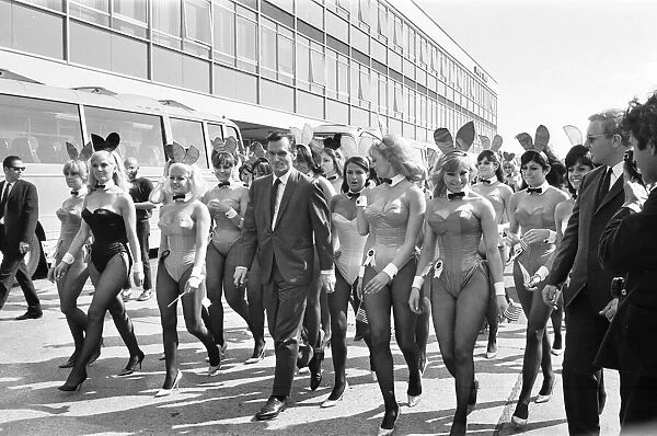 Hugh Hefner Boss of the Playboy Empire arrives with an entourage of Bunny Girls at London