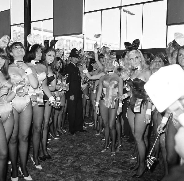 Hugh Hefner Boss of the Playboy Empire arrives with an entourage of Bunny Girls at London
