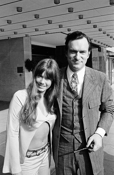 Hugh Hefner outside the Hilton Hotel with his girlfriend Barbara Benton