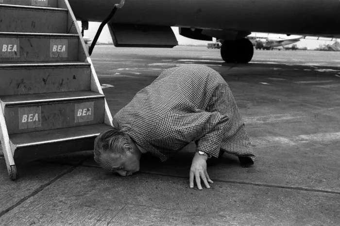 Framed Print : Hughie Green April 1963 Comedian TV Presenter kissing the ground at London Airport Framed Print : Hughie Green April 1963 Comedian TV Presenter kissing the ground at London Airport