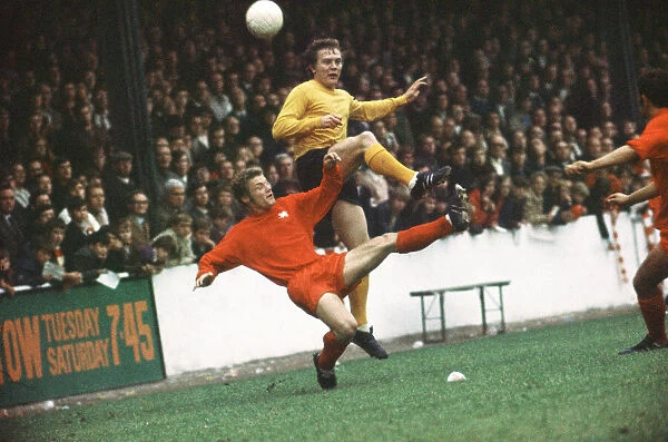 Hull City footballer Ken Wagstaff in action, challenged for the ball by Dennis Rofe of