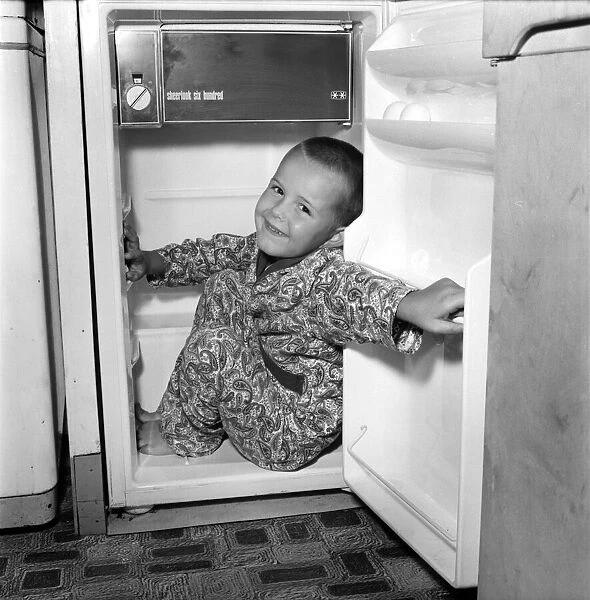 Humour: Unusual: Boy trapped in fridge. July 1970 70-6760-003