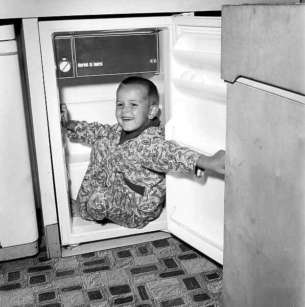 Humour: Unusual: Boy trapped in fridge. July 1970 70-6760-001