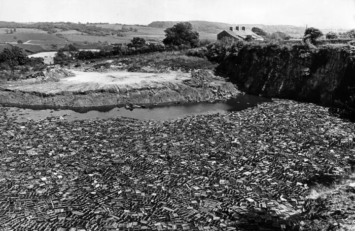 Framed Print : Hundreds of old beer crates float in the disused quarry pond near Wenvoe