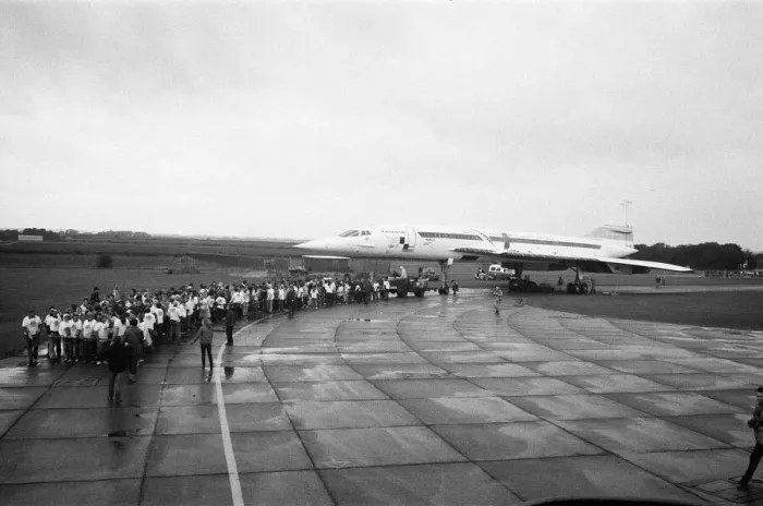 Framed Print : Hundreds of people were drenched by heavy rain as they pulled Concorde around an airfield