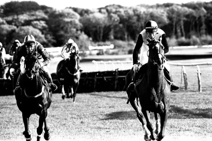 Framed Print : Over the last hurdle safely Narvik (right) is pushed out by Denis Atkins to shrug off