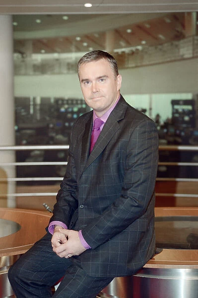 Huw Edwards, BBC Newsreader pictured in his early days of presenting the BBC Six O