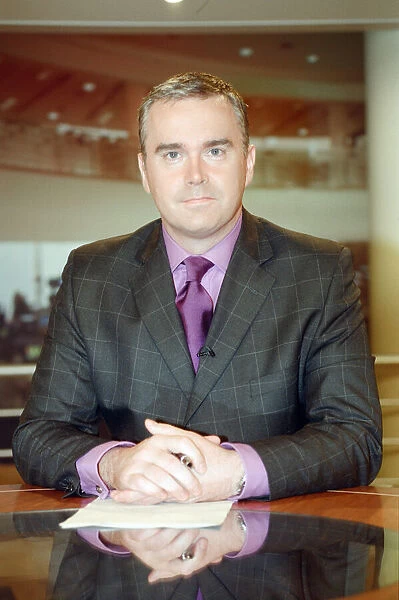 Huw Edwards, BBC Newsreader pictured in his early days of presenting the BBC Six O