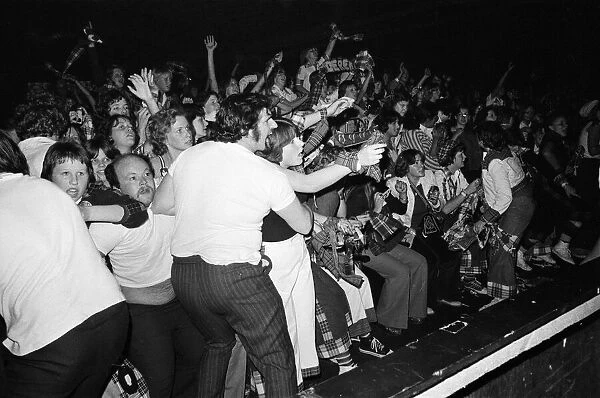 Hysterical fans attend a Bay City Rollers concert in Victoria, London