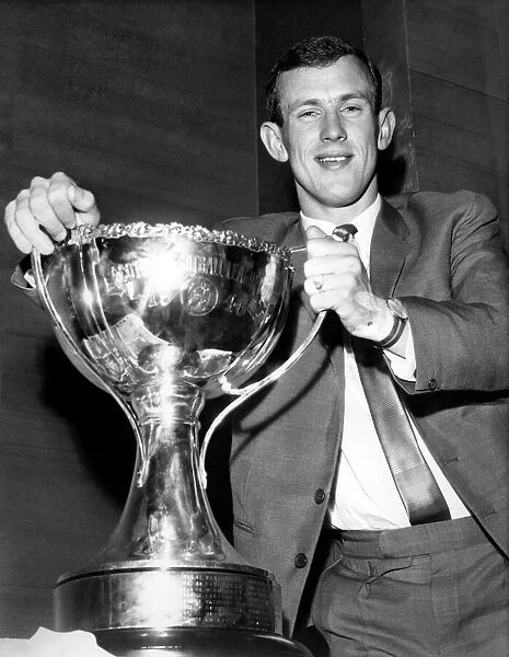 I won it-I hold it! Bobby Lennox triumphantly grasps the Cup he won with that 19th minute