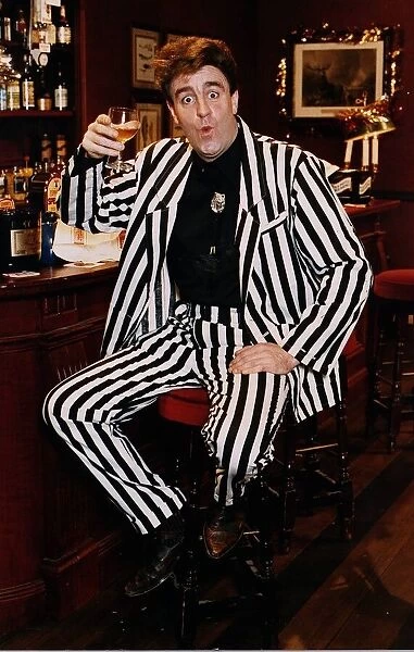 Iain McColl actor white black striped suit bar drink whisky