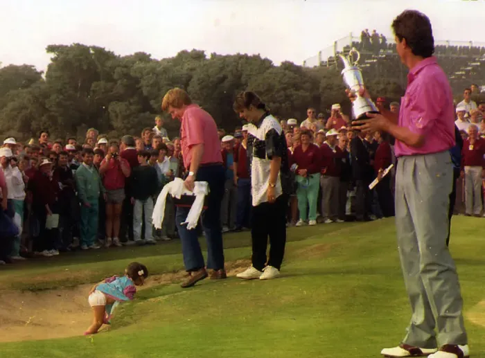Framed Print : Ian Baker Finch holding trophy watching as daughter is slipping in to bunker on the 18th