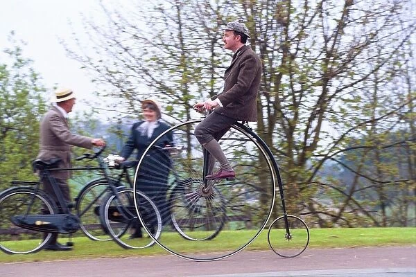 Ian Bean rides an ordinary or high bicycle past fellow friends of Beamish Museum