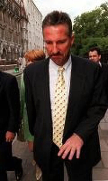 Ian Botham leaving the High Court after losing his libel case against Imran Khan