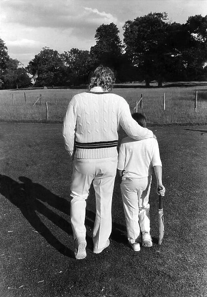 Ian Botham playing cricket with fathers XI again sons XI
