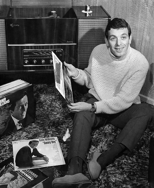Ian Callaghan, Liverpool F. C.s right winger relaxes with his record collection at